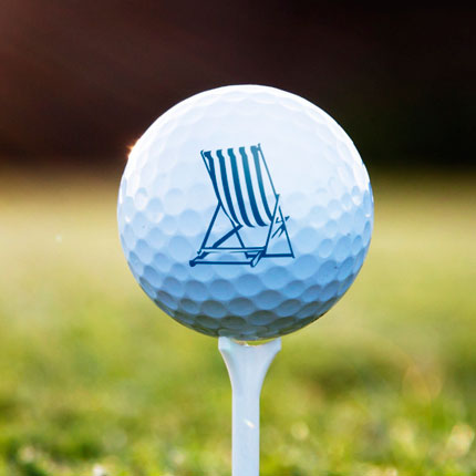 golf ball with dream resorts chair on