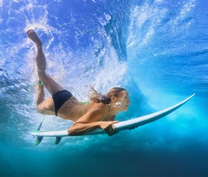 surfing and diving underwater
