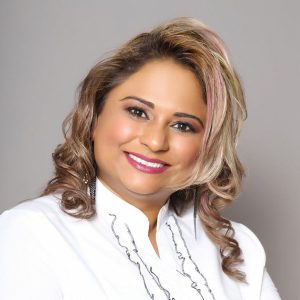 smiling woman with pink streak in her hair