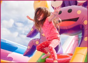 little girl on a jumping castle