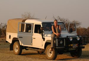 lady sitting on game drive vehicle