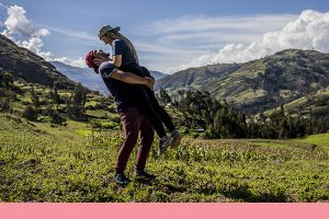 man lifting his girlfriend up